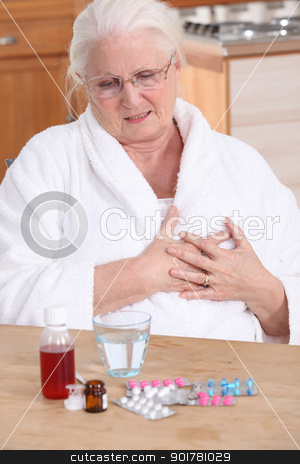Elderly lady taking her medication Elderly lady taking her medication stock photo, Elderly lady taking her medication by photography33