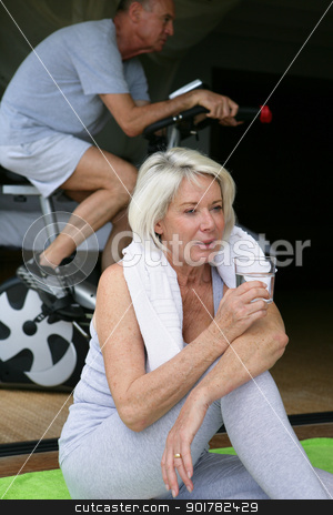 To use this stock image in your creative project, please select the size you need over to the right and click the "Add to Cart" button.
Your downloaded image will come with the Cutcaster watermark removed so don’t worry about the watermark you see on this page. Woman drinking a glass of water during a workout stock photo, Woman drinking a glass of water during a workout by photography33