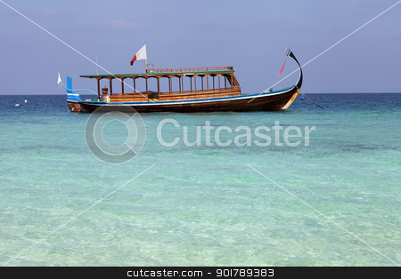 To use this stock image in your creative project, please select the size you need over to the right and click the "Add to Cart" button.
Your downloaded image will come with the Cutcaster watermark removed so don’t worry about the watermark you see on this page. Maldivian fishing boat stock photo, Maldivian fishing boat anchored in shallow water by Abdul Sami Haqqani