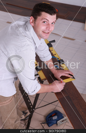 Man laying a wooden floor Man laying a wooden floor stock photo, Man laying a wooden floor by photography33