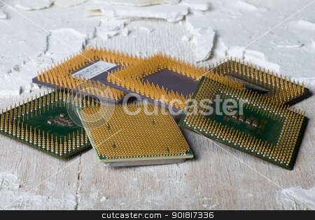To use this stock image in your creative project, please select the size you need over to the right and click the "Add to Cart" button.
Your downloaded image will come with the Cutcaster watermark removed so don’t worry about the watermark you see on this page. Old processors stock photo, Old processors lying on an old surface by Vadim