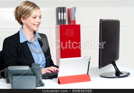 To use this stock image in your creative project, please select the size you need over to the right and click the "Add to Cart" button.
Your downloaded image will come with the Cutcaster watermark removed so don’t worry about the watermark you see on this page. Confident businesswoman working in office stock photo, Confident businesswoman working in office. Concentration on computer screen while typing doucment by Ishay Botbol