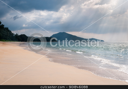 Storm clouds under tropical sandy coast Storm clouds under tropical sandy coast stock photo, Heavy storm clouds and sunbeams under tropical sandy sea coast with clear blue water by Iryna Rasko