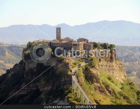 To use this stock image in your creative project, please select the size you need over to the right and click the "Add to Cart" button.
Your downloaded image will come with the Cutcaster watermark removed so don’t worry about the watermark you see on this page. The Italian hill town of Civita di Bagnoregio stock photo, The Italian hill town of Civita di Bagnoregio rests quietly on a hilltop created by earthquake and erosion. by Click Images