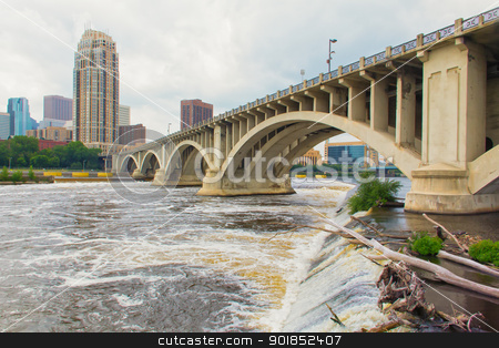 To use this stock image in your creative project, please select the size you need over to the right and click the "Add to Cart" button.
Your downloaded image will come with the Cutcaster watermark removed so don’t worry about the watermark you see on this page. Hennepin Avenue Bridge stock photo, The Mississippi River flows under the Hennepin Avenue Bridge in downtown Minneapolis, Minnesota by Ken Wolter