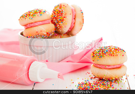 Strawberry cookies Strawberry cookies stock photo, Cookies with strawberry cream covered with sprinkles on white background by p.studio66
