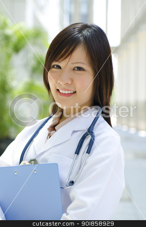 Asian Chinese medical student Asian Chinese medical student stock photo, A young Asian Chinese medical student standing in front modern building by szefei
