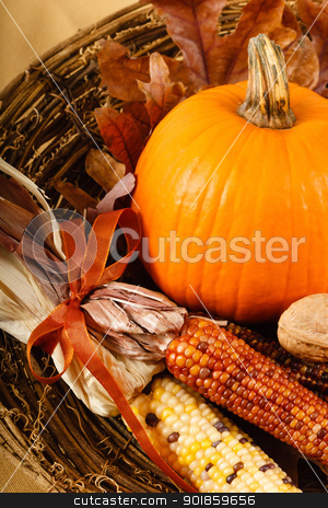 Fall Decorations With Pumpkin And Indian Corn Fall Decorations With Pumpkin And Indian Corn stock photo, A colorful orange pumpkin is nestled in Indian Corn for a traditional Fall or Thanksgiving decoration by Karen Sarraga
