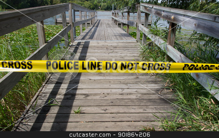 To use this stock image in your creative project, please select the size you need over to the right and click the "Add to Cart" button.
Your downloaded image will come with the Cutcaster watermark removed so don’t worry about the watermark you see on this page. Crime Scene Tape stock photo, Police warn passers-by to stay away from the lake. by Ken Wolter
