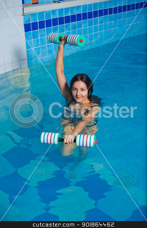 To use this stock image in your creative project, please select the size you need over to the right and click the "Add to Cart" button.
Your downloaded image will come with the Cutcaster watermark removed so don’t worry about the watermark you see on this page. Attractive girl trains in aqua aerobics stock photo, Young beautiful woman doing aqua gym exercise with water dumbbell in a swimming pool by Aikon