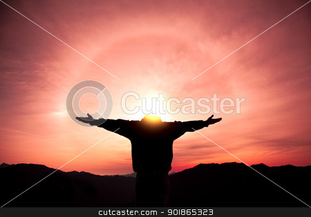 Man standing on the top of mountain and watching the sunrise man standing on the top of mountain and watching the sunrise stock photo, man standing on the top of mountain and watching the sunrise by tomwang