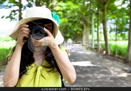 To use this stock image in your creative project, please select the size you need over to the right and click the "Add to Cart" button.
Your downloaded image will come with the Cutcaster watermark removed so don’t worry about the watermark you see on this page. Young traveler taking photo in the green forest stock photo, Young traveler taking photo in the green forest by tomwang