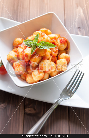 To use this stock image in your creative project, please select the size you need over to the right and click the "Add to Cart" button.
Your downloaded image will come with the Cutcaster watermark removed so don’t worry about the watermark you see on this page. Gnocchi al pomodoro stock photo, homemade gnocchi with tomato sauce basil and onions by Giordano Aita