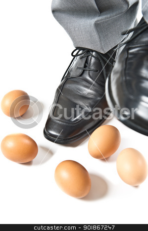 Feet over eggs Feet over eggs stock photo, en's dress shoes stepping over several eggs. by Instudio 68