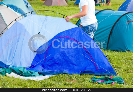 Putting up tent in a camping Putting up tent in a camping stock photo, Putting up tent in a camping by tristanbm