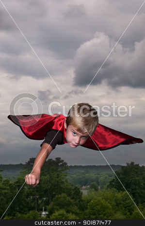 Super Hero Super Hero stock photo, Handsome young boy super hero flying through the sky by Robert Byron
