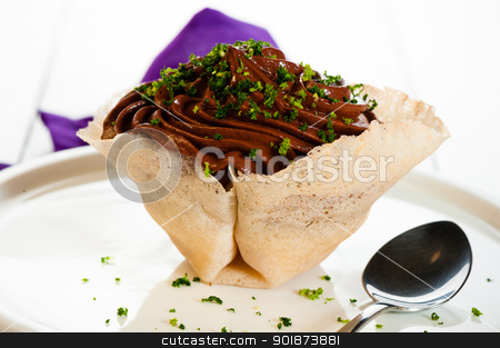 To use this stock image in your creative project, please select the size you need over to the right and click the "Add to Cart" button.
Your downloaded image will come with the Cutcaster watermark removed so don’t worry about the watermark you see on this page. Mousse au chocolat stock photo, Mousse au chocolat in a tuile basket on white wooden table by p.studio66