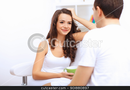 Young happy couple at hone together s Young happy couple at hone together s stock photo, Young happy couple at hone together sitting and talking by Sergey Nivens