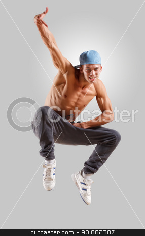 To use this stock image in your creative project, please select the size you need over to the right and click the "Add to Cart" button.
Your downloaded image will come with the Cutcaster watermark removed so don’t worry about the watermark you see on this page. young man dancing hip hop stock photo, young man in a blue cap dancing hip hop by Sergey Nivens