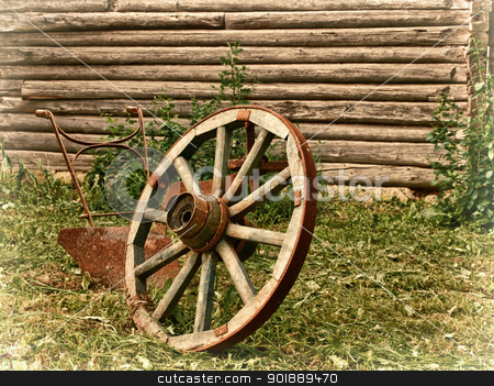 To use this stock image in your creative project, please select the size you need over to the right and click the "Add to Cart" button.
Your downloaded image will come with the Cutcaster watermark removed so don’t worry about the watermark you see on this page. village theme stock photo, wheel and plough on the grass near the wooden wall by Sergej Razvodovskij