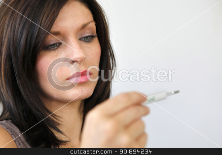 Woman measuring her temperature Woman measuring her temperature stock photo, Woman measuring her temperature by photography33