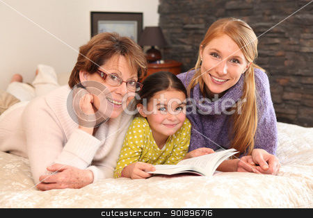 Grandmother, mother, and daughter lying on a bed Grandmother, mother, and daughter lying on a bed stock photo, Grandmother, mother, and daughter lying on a bed by photography33