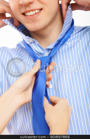 To use this stock image in your creative project, please select the size you need over to the right and click the "Add to Cart" button.
Your downloaded image will come with the Cutcaster watermark removed so don’t worry about the watermark you see on this page. Businessman dressing at home in the morning stock photo, Young businessman dressing at home in the morning. Woman helping to fasten his tie by Sergey Nivens