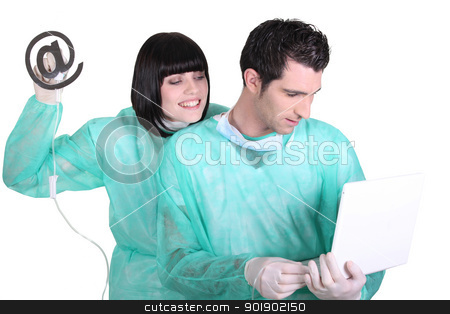 Medical staff using laptop and drip with at sign Medical staff using laptop and drip with at sign stock photo, Medical staff using laptop and drip with at sign by photography33