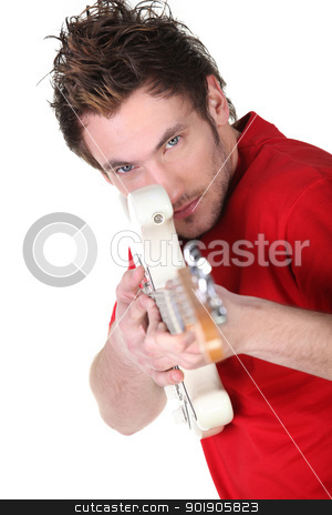 To use this stock image in your creative project, please select the size you need over to the right and click the "Add to Cart" button.
Your downloaded image will come with the Cutcaster watermark removed so don’t worry about the watermark you see on this page. Man pretending electric guitar is a gun stock photo, Man pretending electric guitar is a gun by photography33