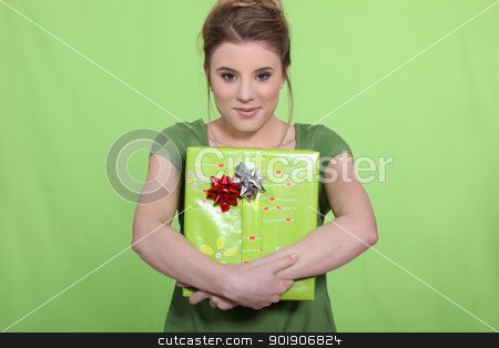 To use this stock image in your creative project, please select the size you need over to the right and click the "Add to Cart" button.
Your downloaded image will come with the Cutcaster watermark removed so don’t worry about the watermark you see on this page. Woman in green with a green present stock photo, Woman in green with a green present by photography33