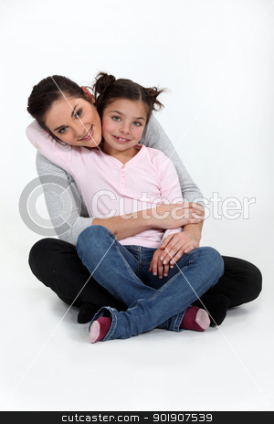 A mother and her daughter hugging. A mother and her daughter hugging. stock photo, A mother and her daughter hugging. by photography33