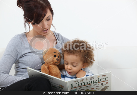 To use this stock image in your creative project, please select the size you need over to the right and click the "Add to Cart" button.
Your downloaded image will come with the Cutcaster watermark removed so don’t worry about the watermark you see on this page. Mother reading story to son stock photo, Mother reading story to son by photography33