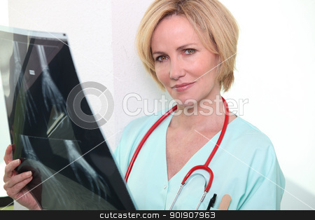 To use this stock image in your creative project, please select the size you need over to the right and click the "Add to Cart" button.
Your downloaded image will come with the Cutcaster watermark removed so don’t worry about the watermark you see on this page. Female nurse holding x-ray image stock photo, Female nurse holding x-ray image by photography33