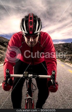 Cyclist on the road Cyclist on the road stock photo, Cyclist on road bike through a asphalt road in the mountains and blue sky with clouds. by Homydesign