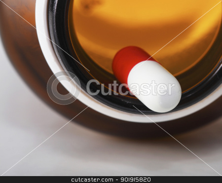 To use this stock image in your creative project, please select the size you need over to the right and click the "Add to Cart" button.
Your downloaded image will come with the Cutcaster watermark removed so don’t worry about the watermark you see on this page. Pills stock photo, close up of the pill and bottle by eskaylim