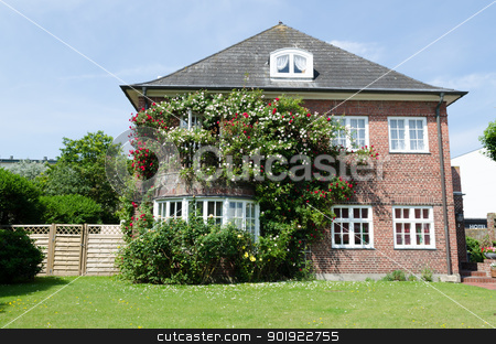 House with roses House with roses stock photo, Roses in front of a house withe windows by Picturehunter