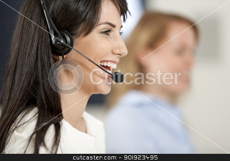 Women in a busy call centre Women in a busy call centre stock photo, Two colleagues working in a busy call centre office. by Gareth Lewis