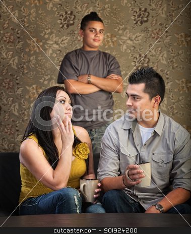 To use this stock image in your creative project, please select the size you need over to the right and click the "Add to Cart" button.
Your downloaded image will come with the Cutcaster watermark removed so don’t worry about the watermark you see on this page. Family With Stubborn Son stock photo, Serious Native American mother and father with stubborn son by Scott Griessel