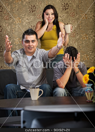 To use this stock image in your creative project, please select the size you need over to the right and click the "Add to Cart" button.
Your downloaded image will come with the Cutcaster watermark removed so don’t worry about the watermark you see on this page. Excited Family Watching TV stock photo, Excited man and woman with distraught son watching television by Scott Griessel