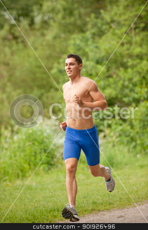 Young and happy jogger Young and happy jogger stock photo, Young and smiling jogger in the park by Picturehunter