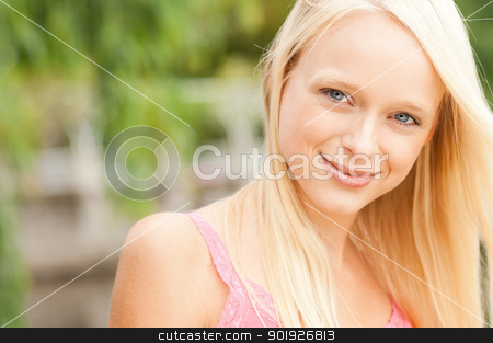 To use this stock image in your creative project, please select the size you need over to the right and click the "Add to Cart" button.
Your downloaded image will come with the Cutcaster watermark removed so don’t worry about the watermark you see on this page. Young and smiling woman stock photo, Portrait from a young and beautiful woman by Picturehunter