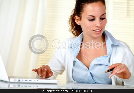 Lovely businesswoman working at office Lovely businesswoman working at office stock photo, Lovely businesswoman working at office with her laptop by pablocalvog