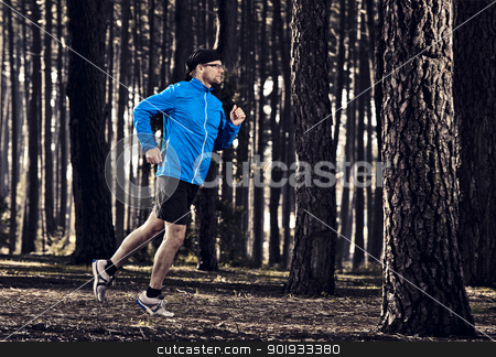 To use this stock image in your creative project, please select the size you need over to the right and click the "Add to Cart" button.
Your downloaded image will come with the Cutcaster watermark removed so don’t worry about the watermark you see on this page. Runing in the forest stock photo, Athletic man doing exercise, running in the forest by ikostudio