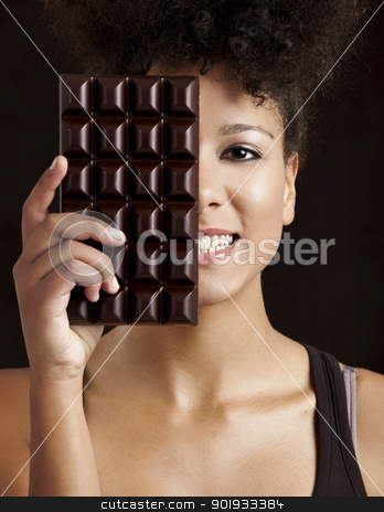 To use this stock image in your creative project, please select the size you need over to the right and click the "Add to Cart" button.
Your downloaded image will come with the Cutcaster watermark removed so don’t worry about the watermark you see on this page. Woman with a chocolate bar stock photo, Beautiful african woman holding a huge dark chocolate bar by ikostudio
