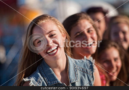 To use this stock image in your creative project, please select the size you need over to the right and click the "Add to Cart" button.
Your downloaded image will come with the Cutcaster watermark removed so don’t worry about the watermark you see on this page. Young Blond Girl Laughing with Friends stock photo, Blond teenager with friends laughing outdoors by Scott Griessel