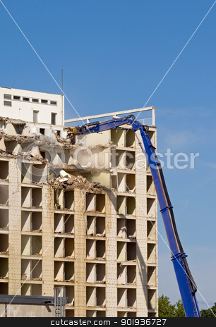 To use this stock image in your creative project, please select the size you need over to the right and click the "Add to Cart" button.
Your downloaded image will come with the Cutcaster watermark removed so don’t worry about the watermark you see on this page. Building demolition stock photo, Machine taking down a large residential building by Harry Huber