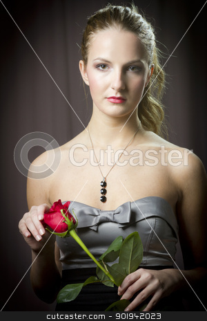 To use this stock image in your creative project, please select the size you need over to the right and click the "Add to Cart" button.
Your downloaded image will come with the Cutcaster watermark removed so don’t worry about the watermark you see on this page. girl with rose stock photo, Attractive woman holding a rose on Valentine's day, by Peter Mikuska