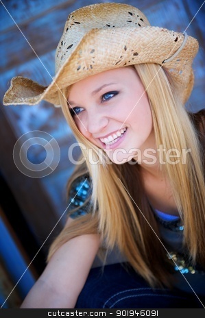 To use this stock image in your creative project, please select the size you need over to the right and click the "Add to Cart" button.
Your downloaded image will come with the Cutcaster watermark removed so don’t worry about the watermark you see on this page. Attractive Blond Model Smiles While Wearing Cowboy Hat stock photo, Attractive Blond Model Smiles While Wearing a Tattered Old Cowboy Hat by Shane Morris