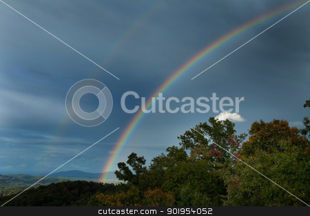 To use this stock image in your creative project, please select the size you need over to the right and click the "Add to Cart" button.
Your downloaded image will come with the Cutcaster watermark removed so don’t worry about the watermark you see on this page. Double Rainbow stock photo, A double rainbow in the Smokey Mountains. by Joe Tabb