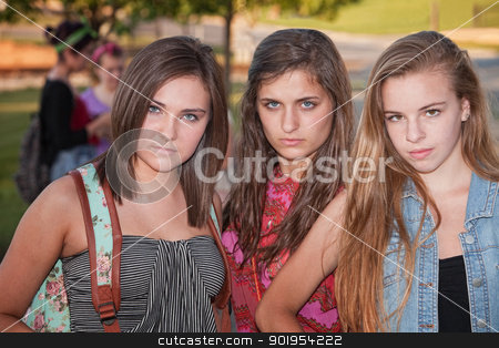 To use this stock image in your creative project, please select the size you need over to the right and click the "Add to Cart" button.
Your downloaded image will come with the Cutcaster watermark removed so don’t worry about the watermark you see on this page. Tough Girls Outside stock photo, Trio of tough stylish teenage female students hanging out by Scott Griessel